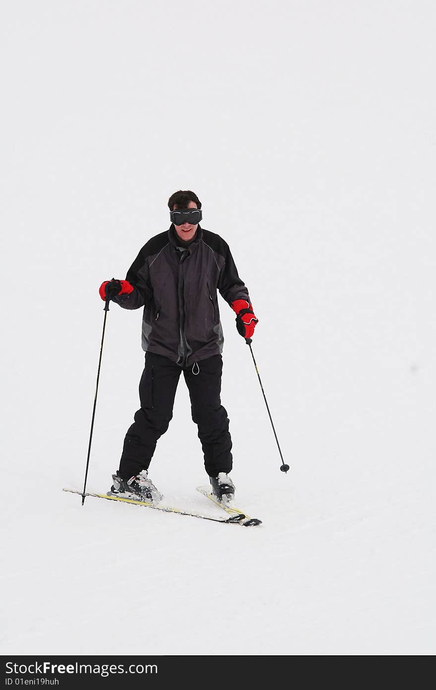 Portrait of man doing snowplough. Portrait of man doing snowplough