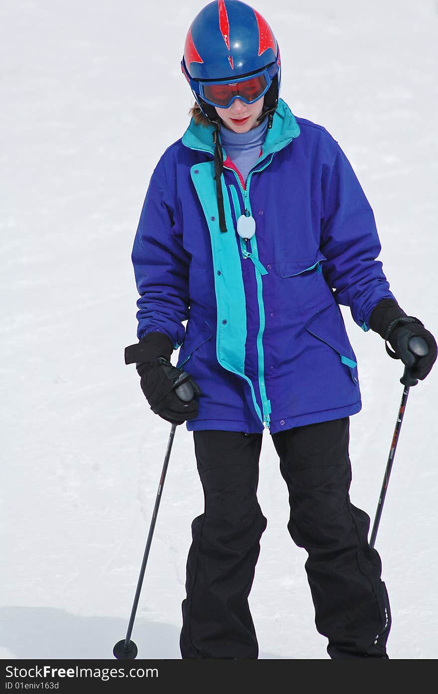 Portrait of girl skiing downhill