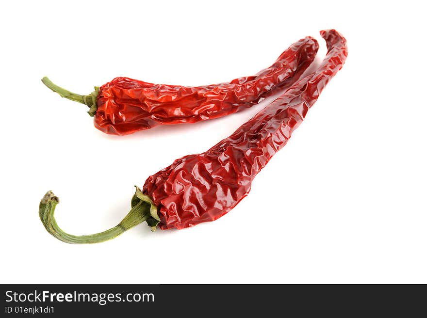 Dried red hot chili pepper isolated on white