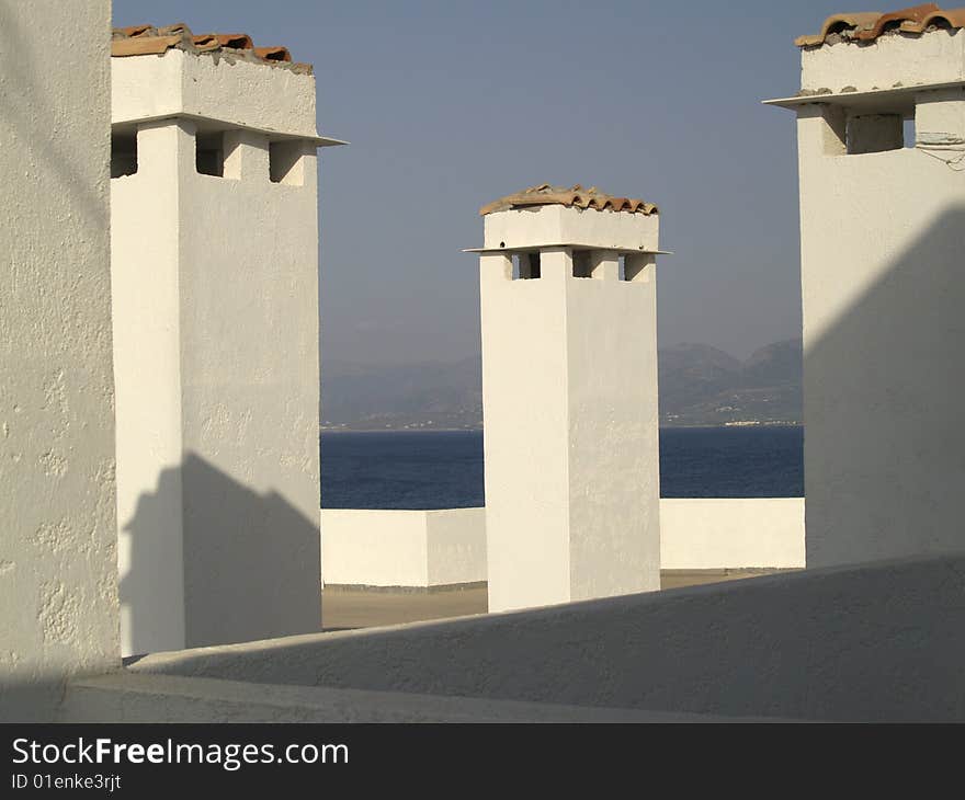 Ð¡himneys on the roof in Crete, Greece