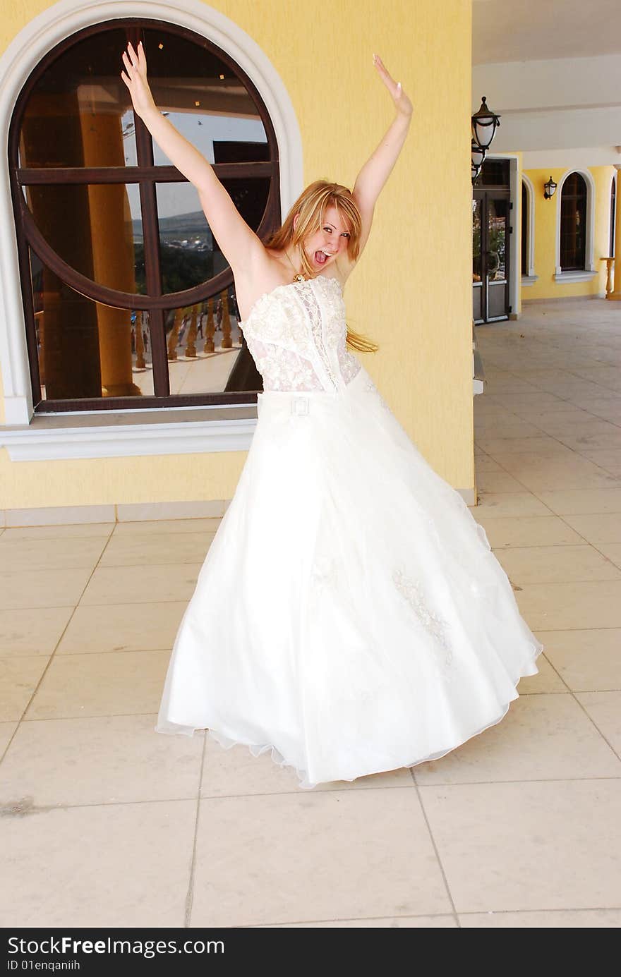 The happy girl in a wedding dress