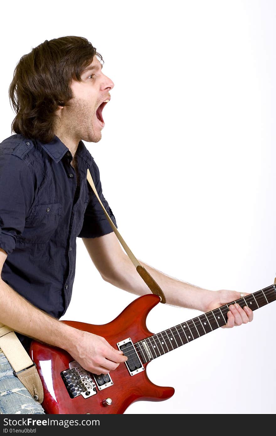 Guitar player playing his guitar and screaming. Guitar player playing his guitar and screaming