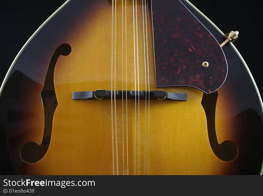 Mandolin, a musical instrument isolated on black background. Mandolin, a musical instrument isolated on black background