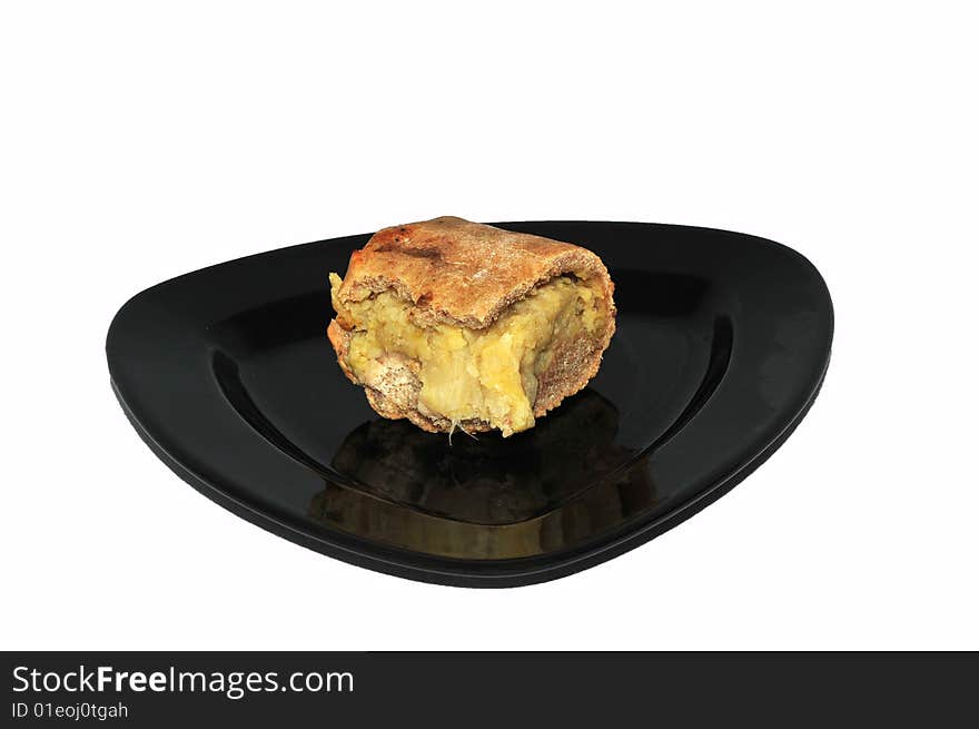 Bio cabbage cake on black plate with white background