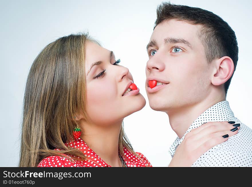 Romantic couple with heart-shaped candies