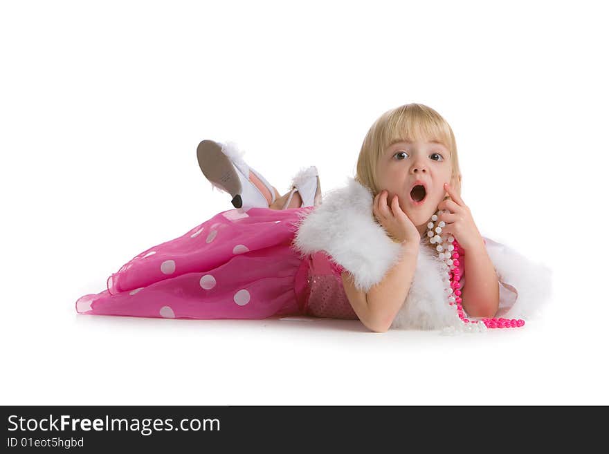 Little girl with a surprised expression, laying on the ground on white background. Little girl with a surprised expression, laying on the ground on white background.