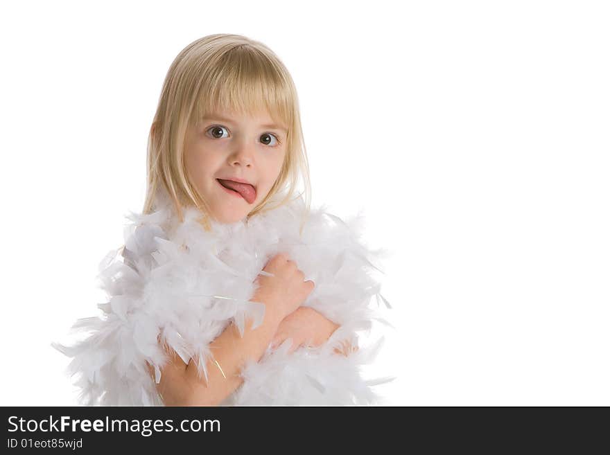 Little girl wearing a white boa making a funny face on a white background.