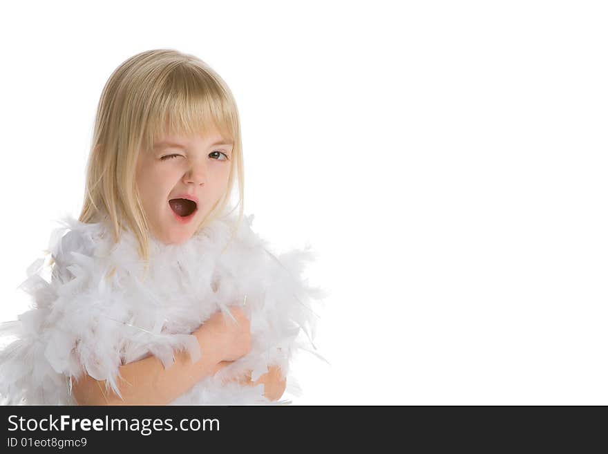 Little girl wearing a white boa winking at the camera on a white background. Little girl wearing a white boa winking at the camera on a white background.