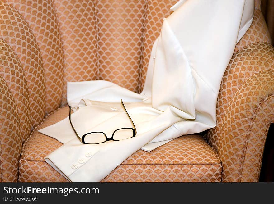 Woman's Coat and Eye Glasses on Seat