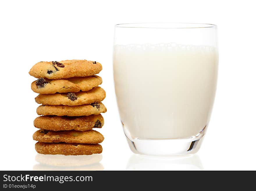 A stack of cookies and glass of milk with shadow isolated on a white background. A stack of cookies and glass of milk with shadow isolated on a white background.