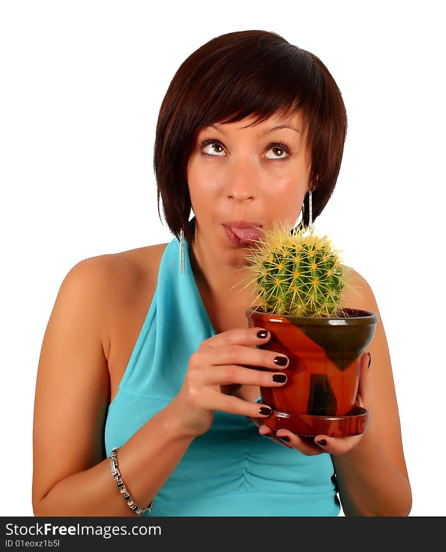 Young girl licking the cactus in flowerpot