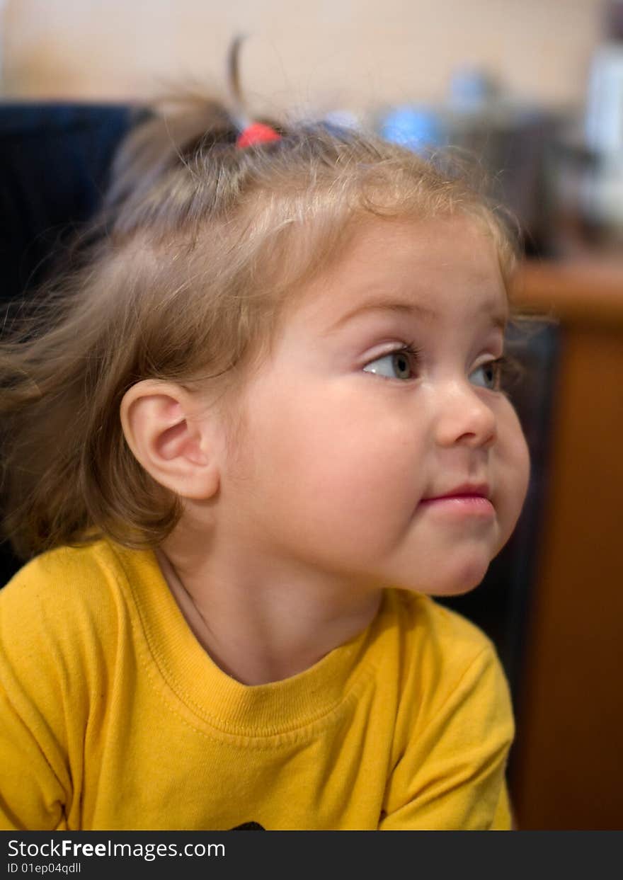 Beautiful little girl in yellow t-shirt