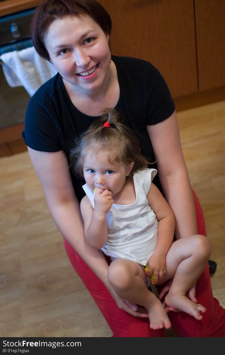 Beautiful little girl on mother's hands. Beautiful little girl on mother's hands