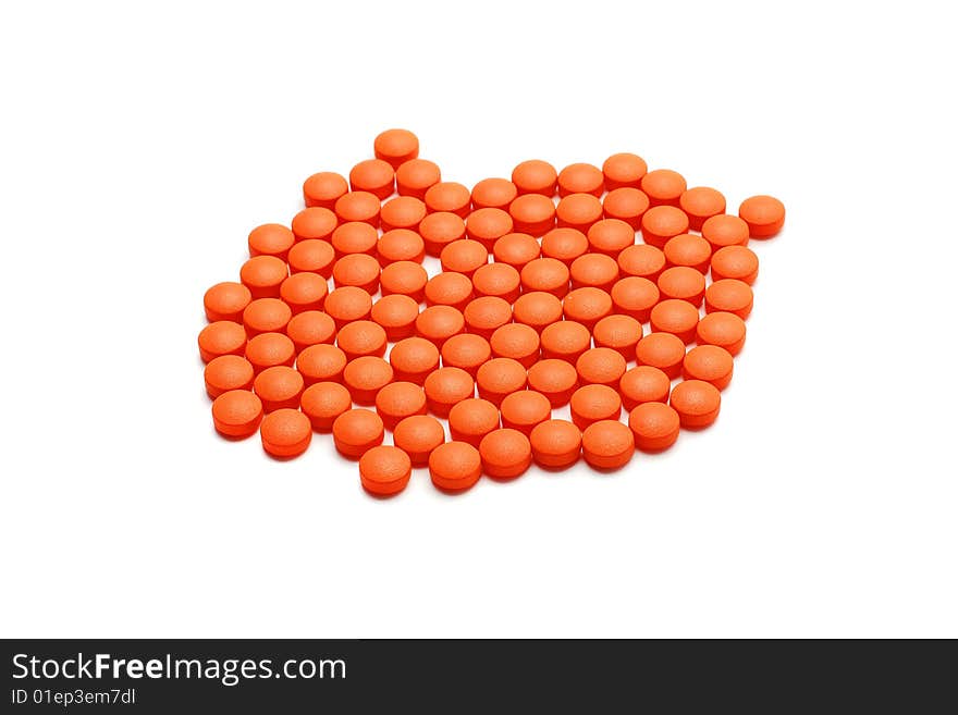 Orange pills isolated on white