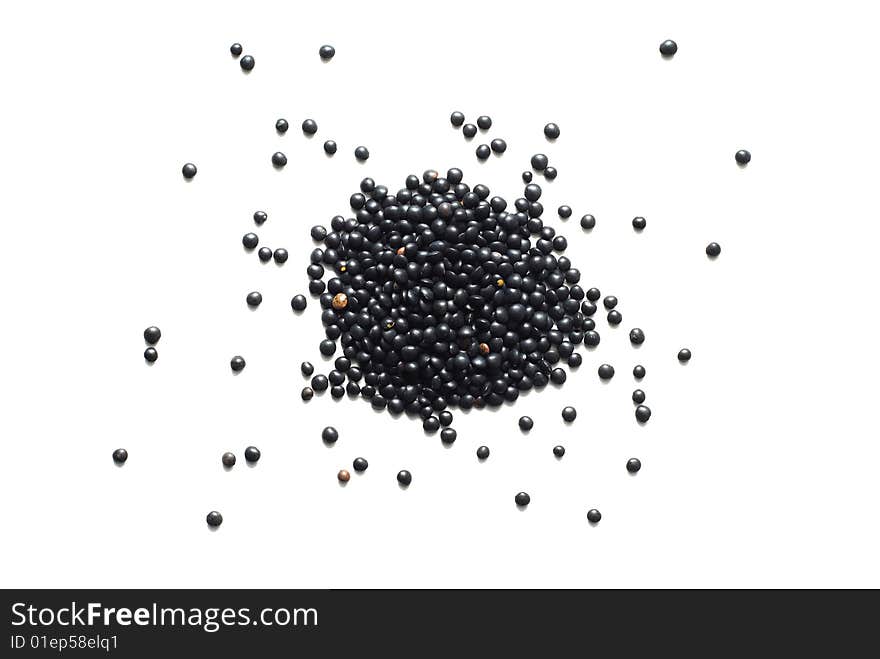 Black lentil isolated on white