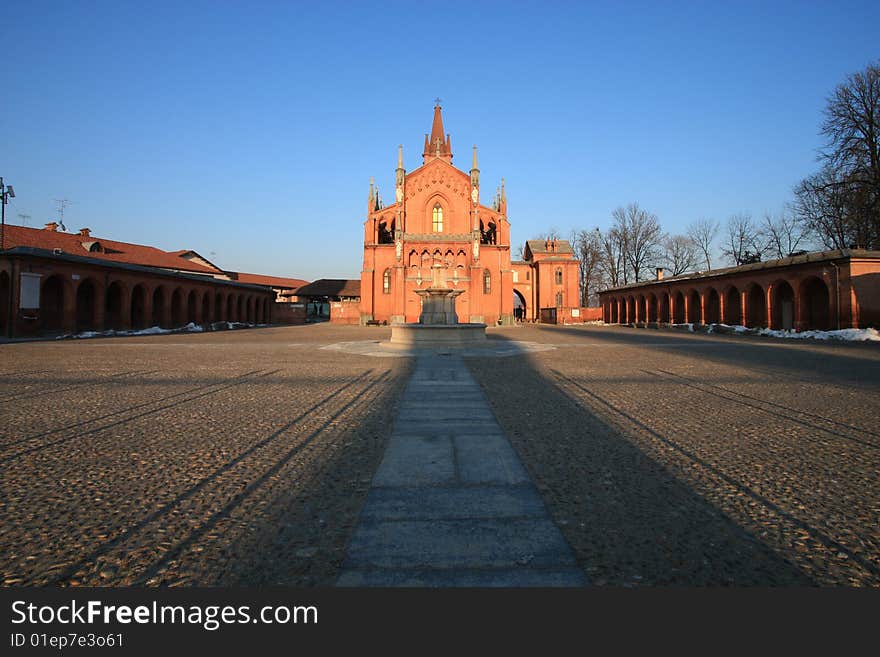 Description: Main square in Pollenzo city Italy. church and colonnade! Pollenzo is an ancient roman city. Earlier it was a summer residence of House of Savoy.