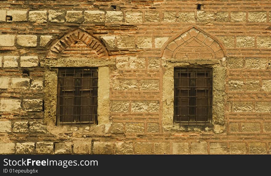 Arabesque style windows on the old wall