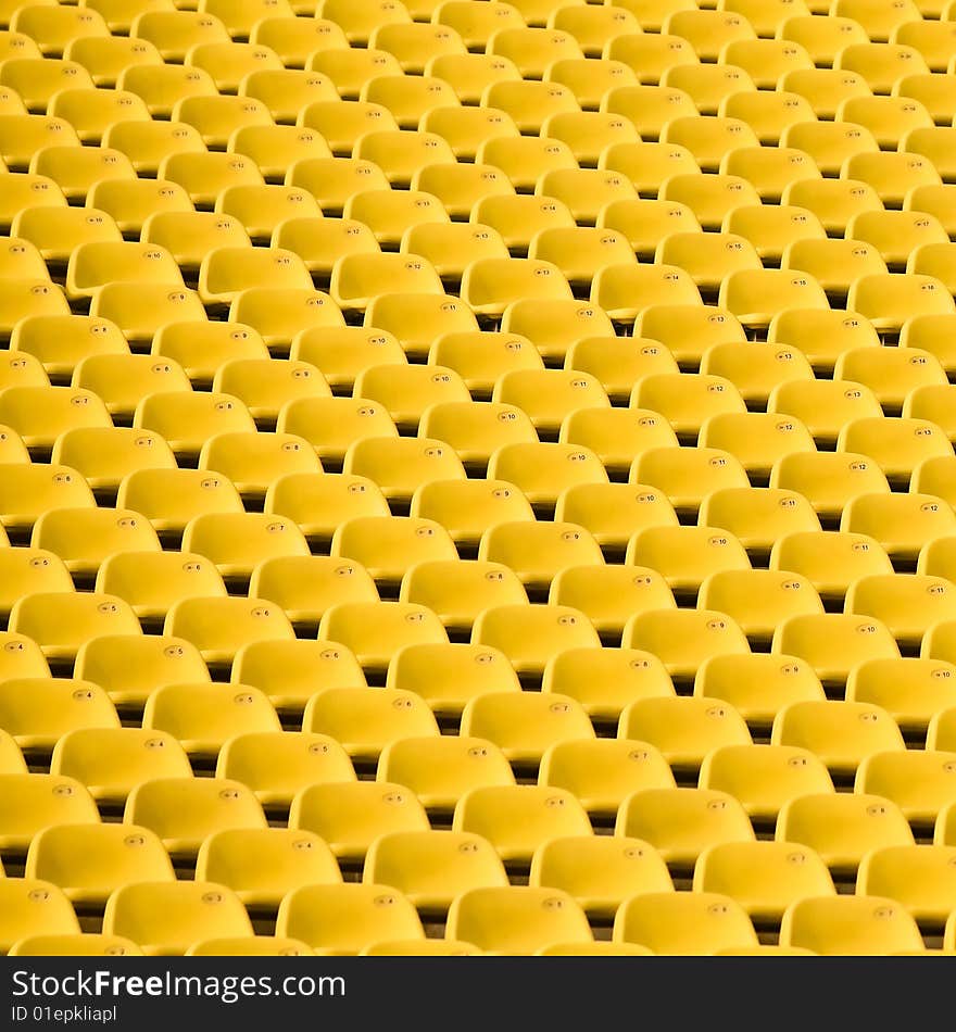 Abstract created by the repeating patterns of stadium seats