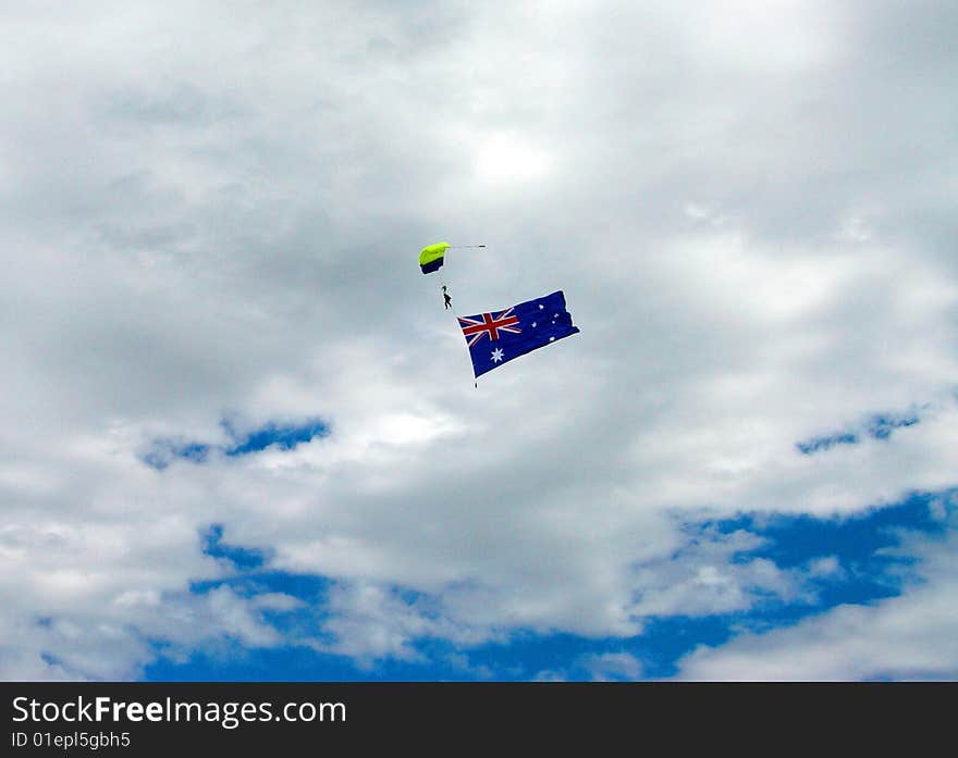 A skydiver with the Australian Flag (over Melbourne). A skydiver with the Australian Flag (over Melbourne).