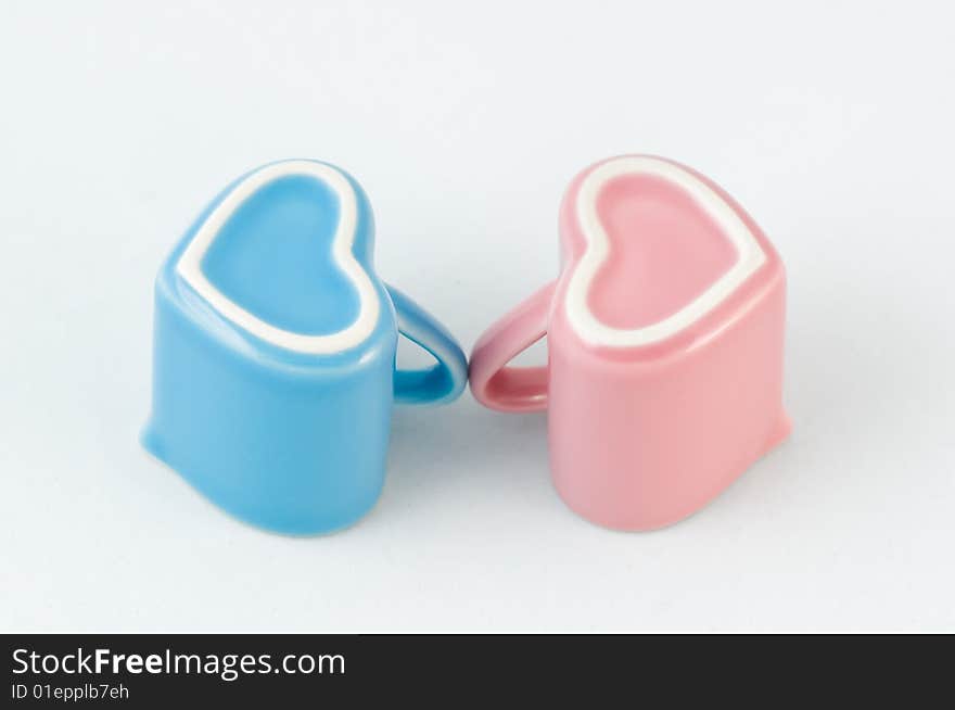 Two Heart-shape Cups On White Background