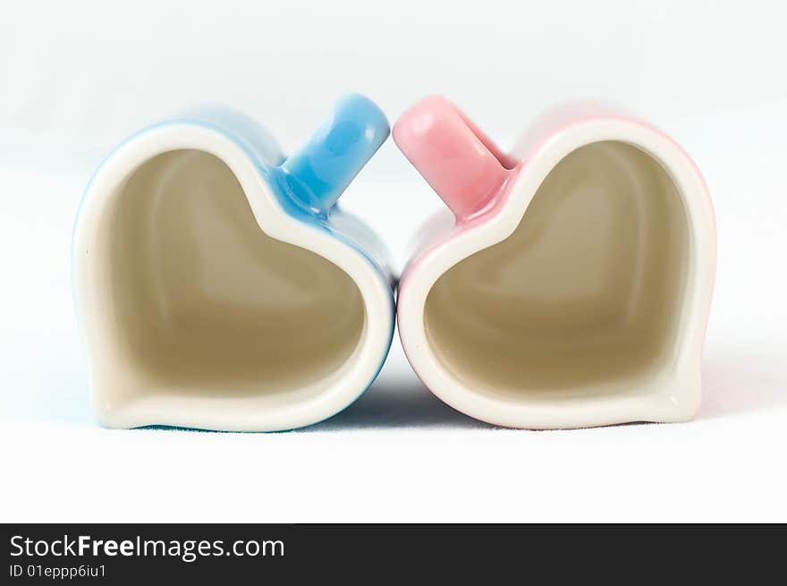 Two Heart-shape Cups On White Background