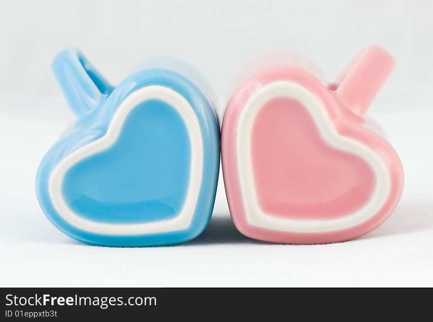 Two Heart-shape Cups On White Background