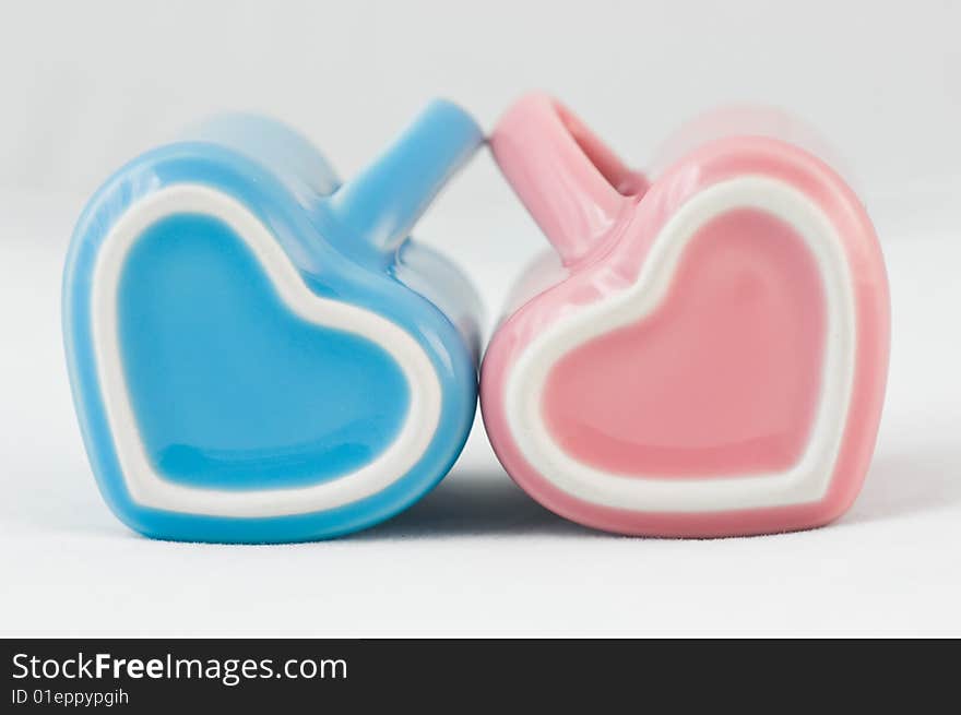 Two Heart-shape Cups On White Background