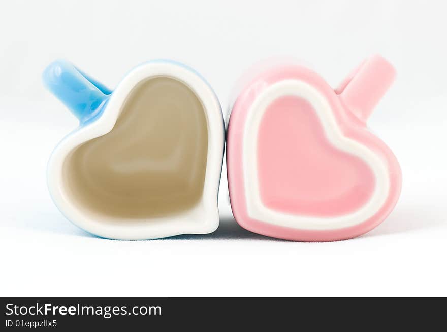 Two Heart-shape Cups On White Background