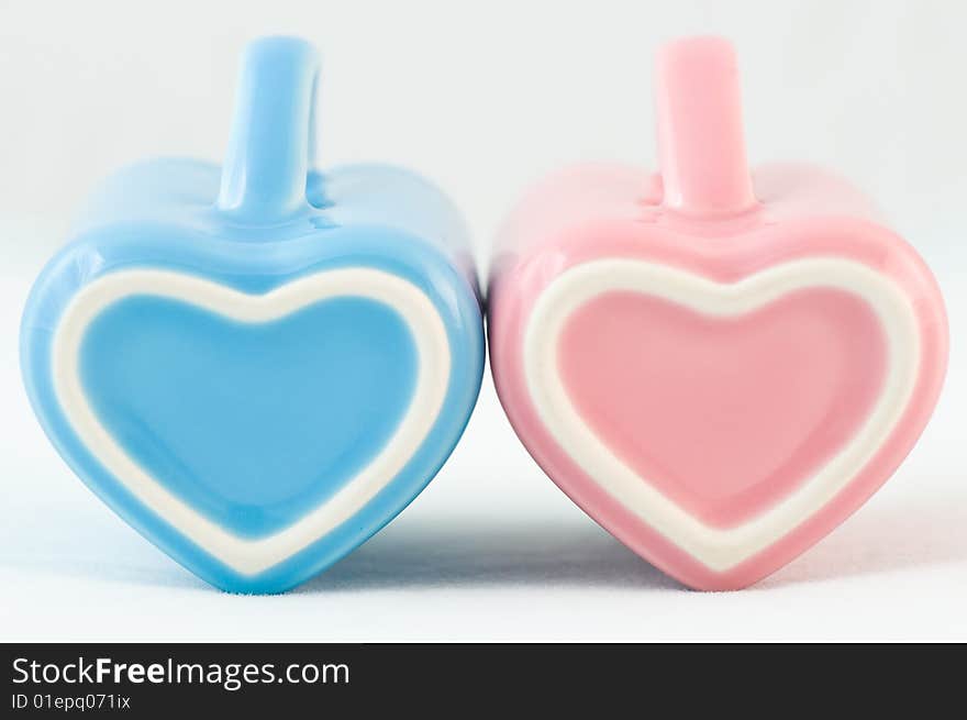 Two heart-shape cups on white background