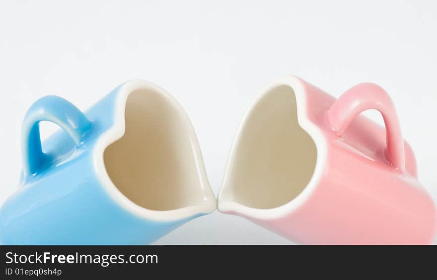 Two Heart-shape Cups On White Background