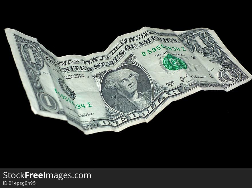 An image of an isolated wrinkled American dollar bill.  The image is to illustrate rough time in America. An image of an isolated wrinkled American dollar bill.  The image is to illustrate rough time in America.