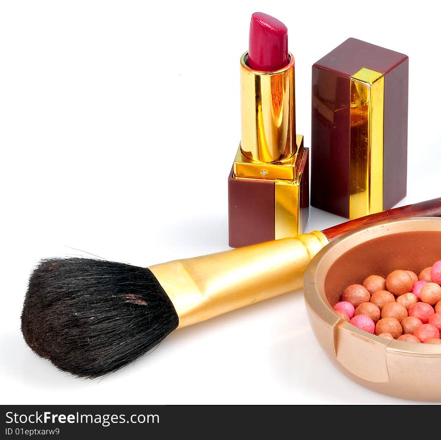 Makeup brushes and lipsticks isolated on white. Makeup brushes and lipsticks isolated on white.