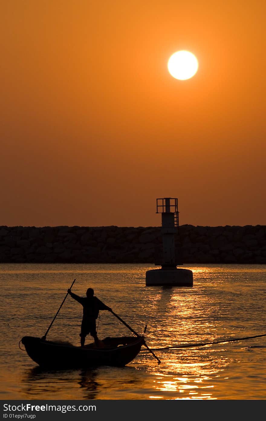 Sunset with boat and light tower. Sunset with boat and light tower