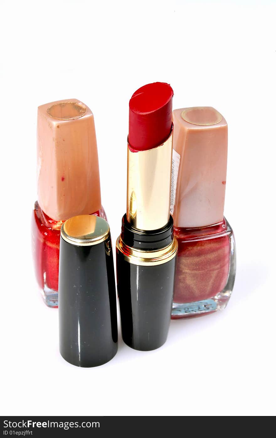 Lipsticks and nail paints isolated on white. Lipsticks and nail paints isolated on white.