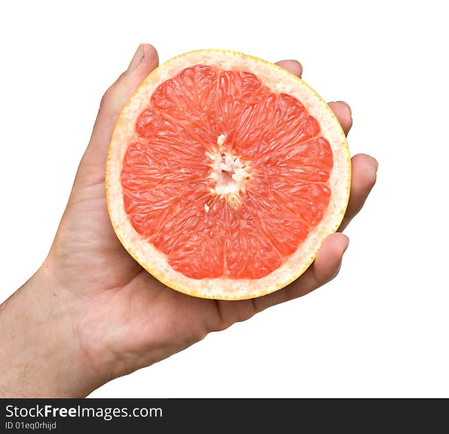 Hand Holding Section Of Grapefruit