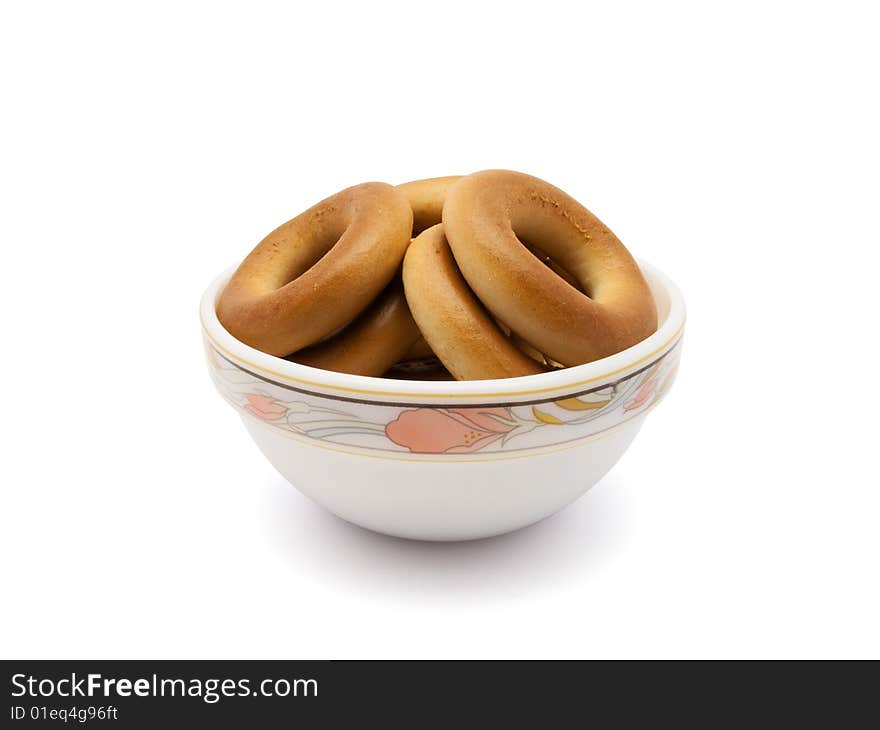 Much bagels in saucer isolated on white background with path