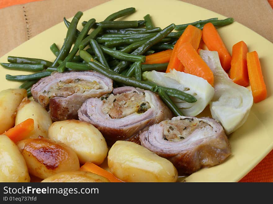 Filled rolled lamb with roast potatoes