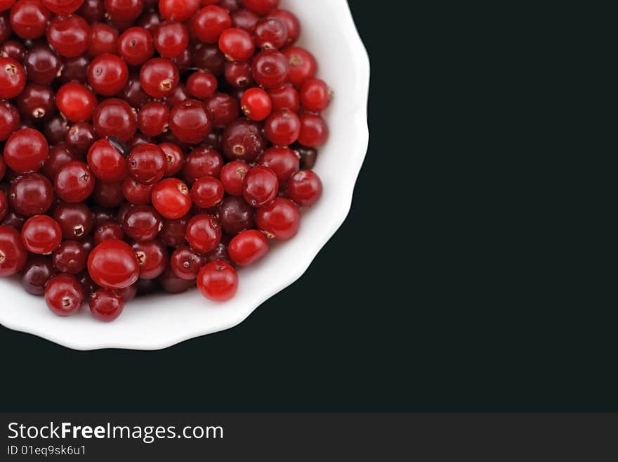 Fresh cranberry on a plate.