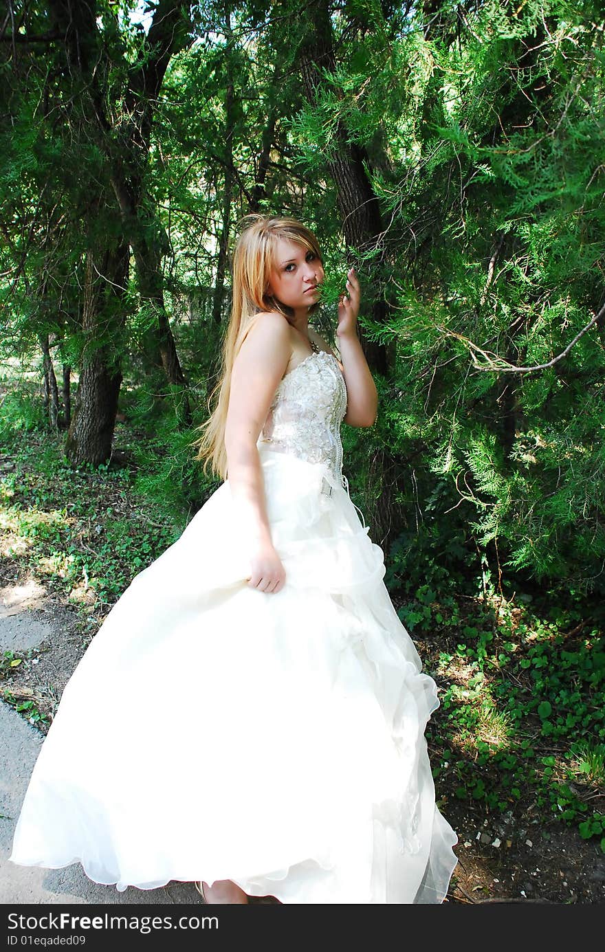 The happy girl in a wedding dress