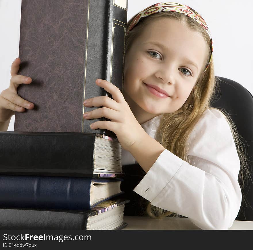 Young student with the books in the classroom. Young student with the books in the classroom