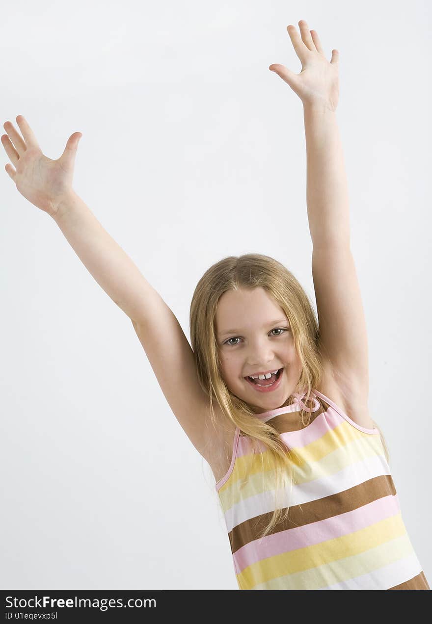 Happy little girl on a white background