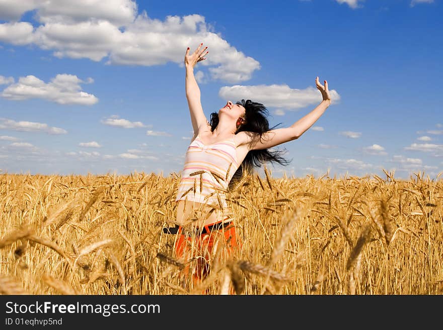 Woman in golden wheat