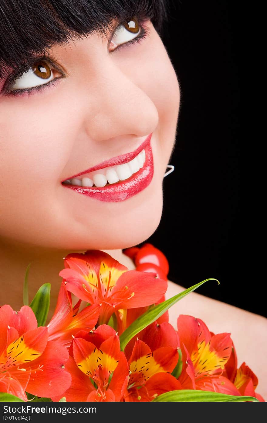 Young woman with red flowers