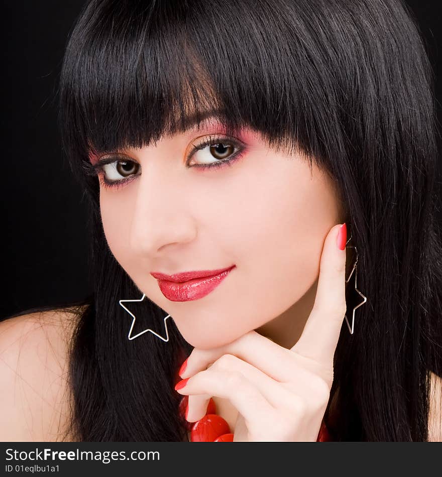 Portrait of the charming woman on black background