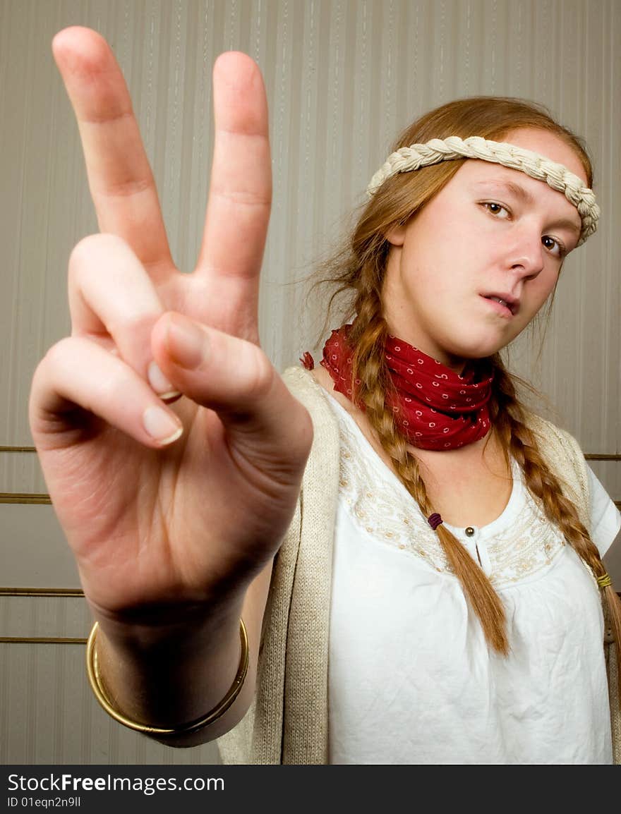 Alternative hippy girl halds hands in the peace sign. Alternative hippy girl halds hands in the peace sign