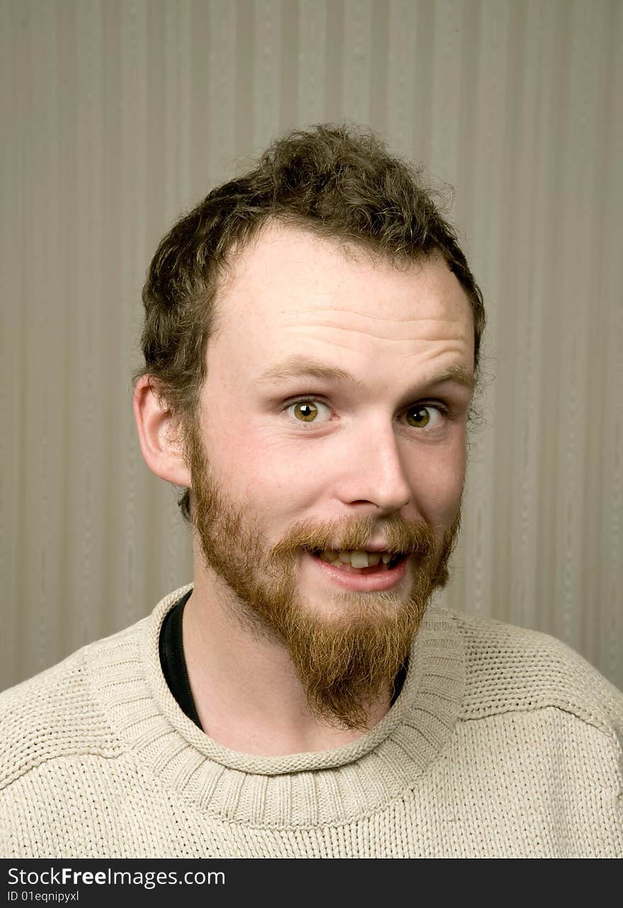 Young man with beard in wool jumper. Young man with beard in wool jumper