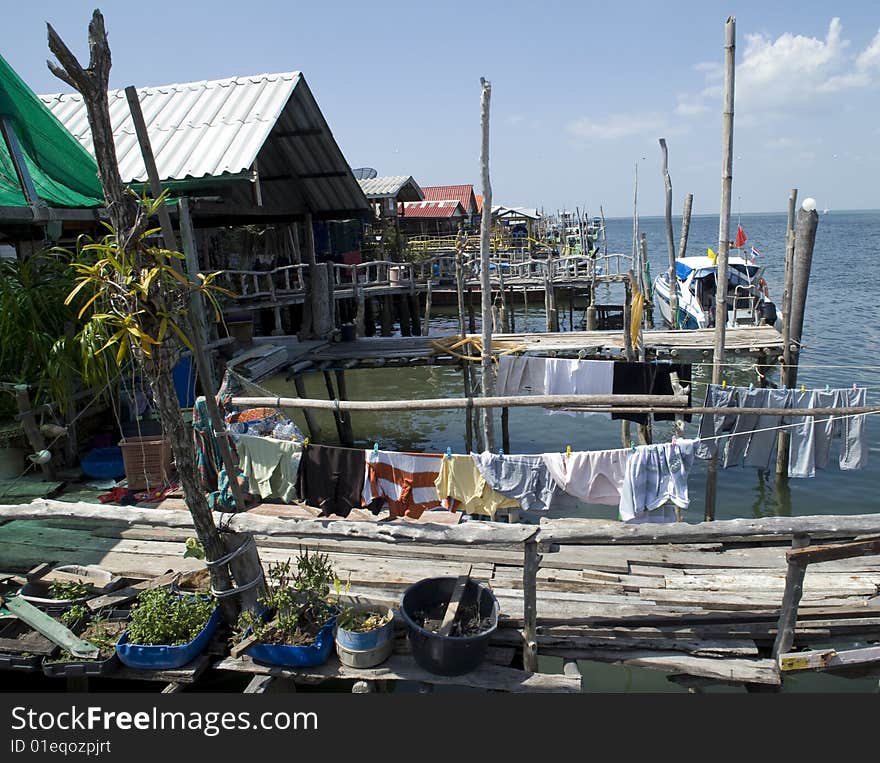 Houses built on the shore in a tropical climate. Houses built on the shore in a tropical climate