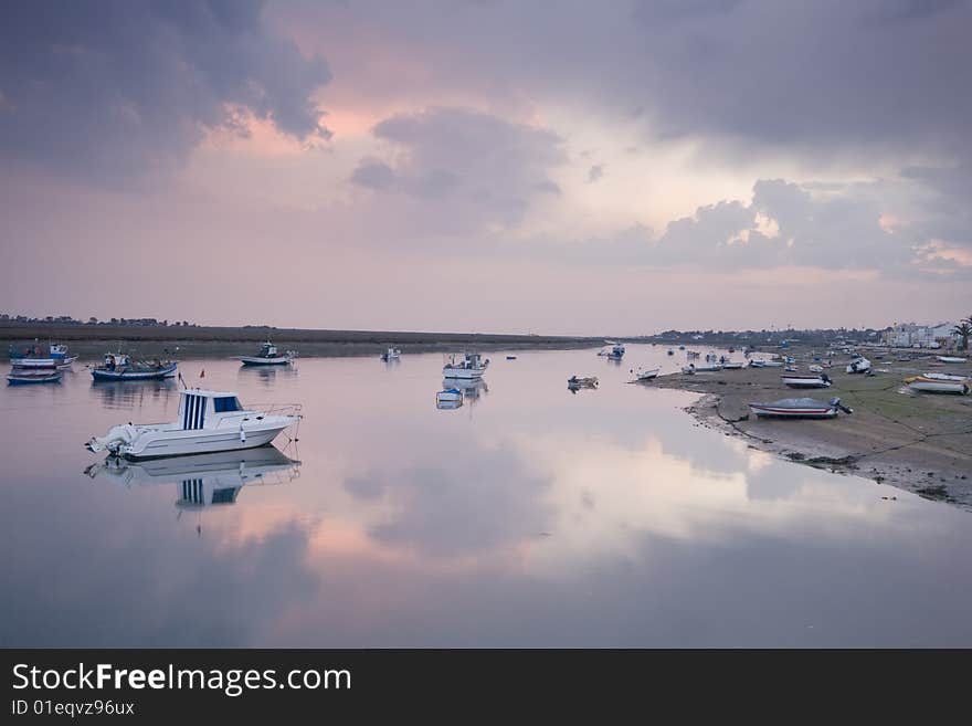 Small boats on Santa Luzia sea channel, Tavira, south of Portugal