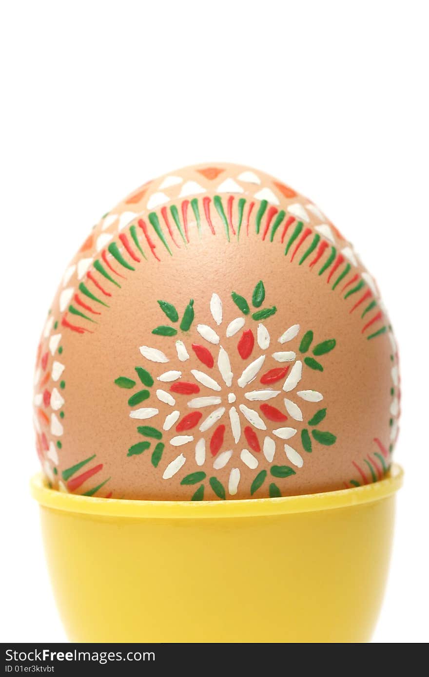 Hand painted Easter Egg with pagan ornaments on white.