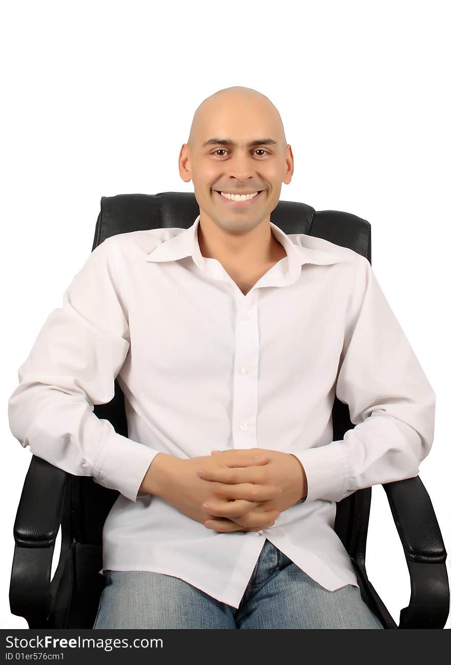 Bald handsome man in armchair isolated over white